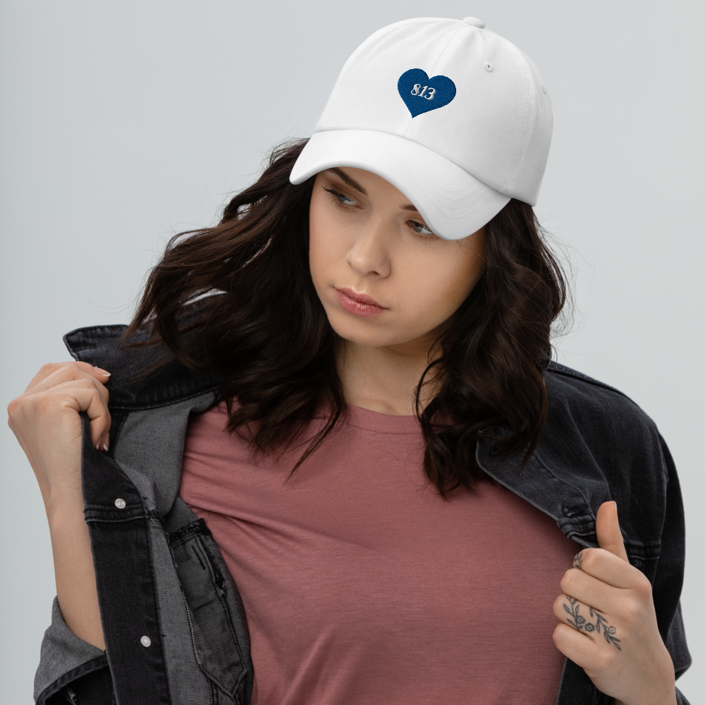 Woman wearing white Tampa Bay Area Code Hat.