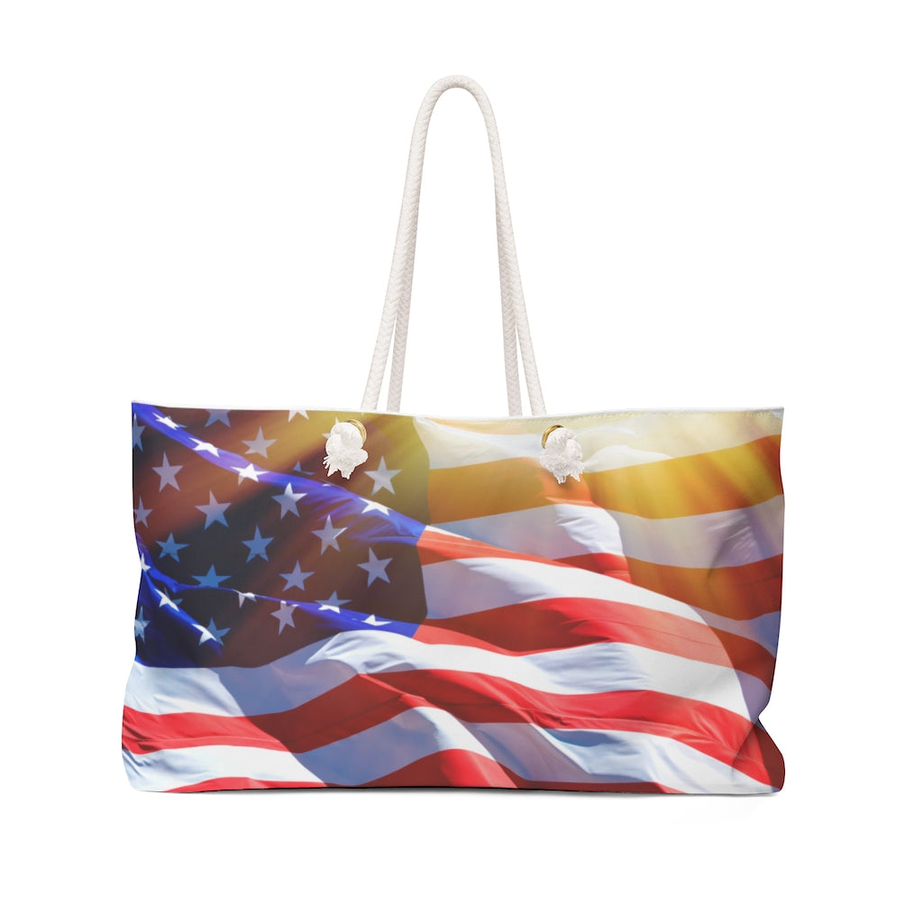 Oversized USA Weekender bag with American flag design and rope handles, displayed upright.