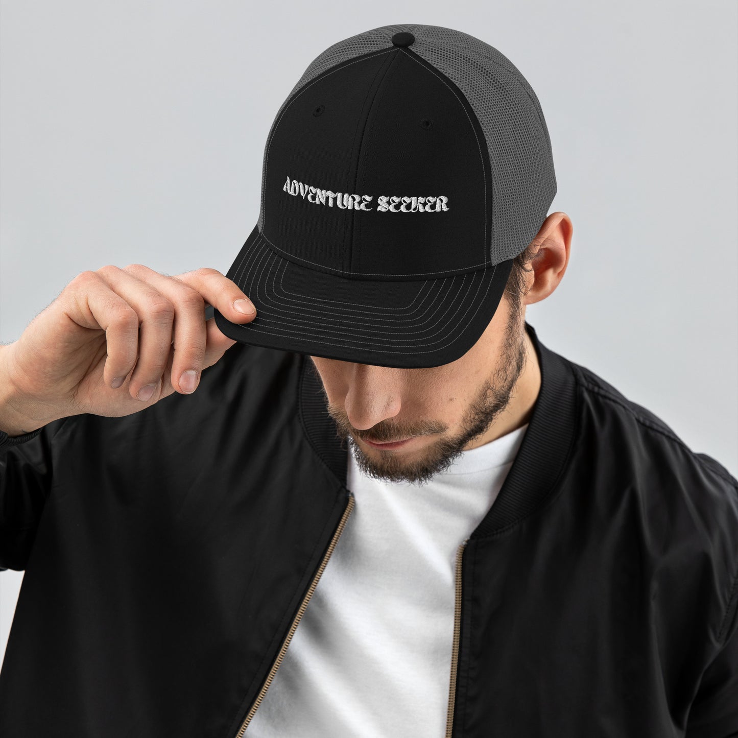 Man Wearing Adventure Seeker Trucker Hat - Black Front