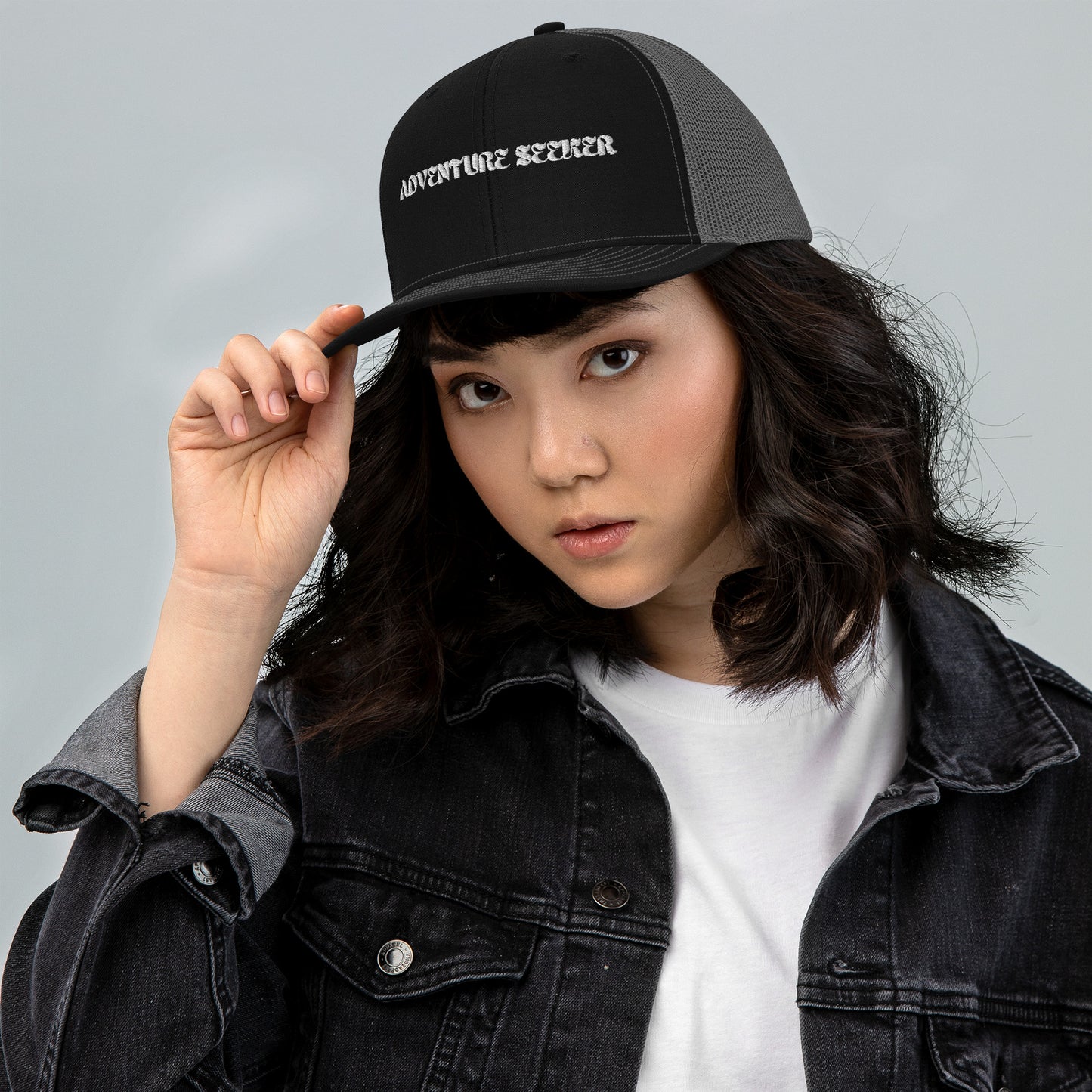 Woman Wearing Adventure Seeker Trucker Hat - Black Front