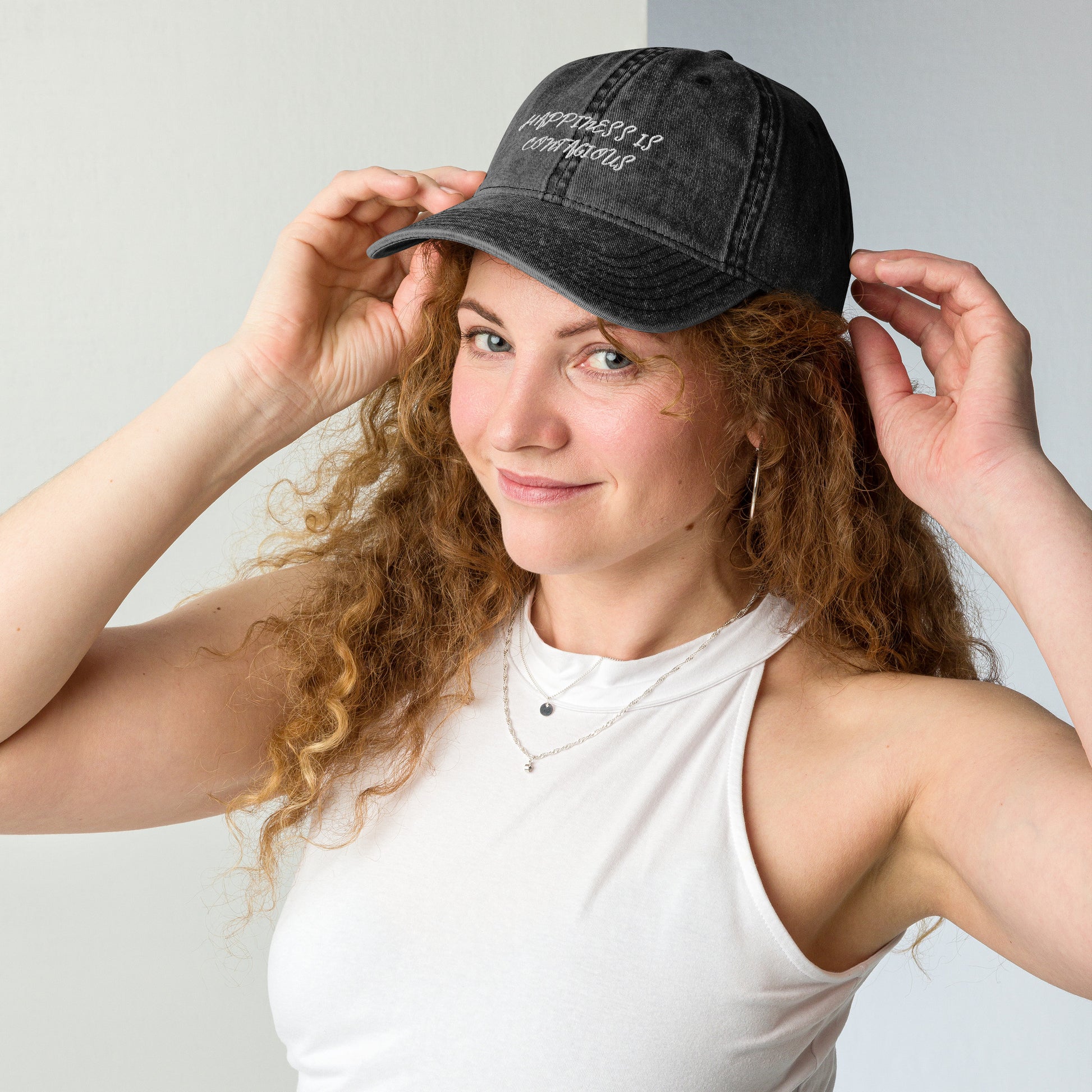 Woman Wearing Happiness Is Contagious Hat - Black Front