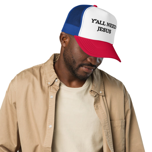 Man wearing red, white, and blue Christian Y’ALL NEED JESUS Trucker Hat with bold black text