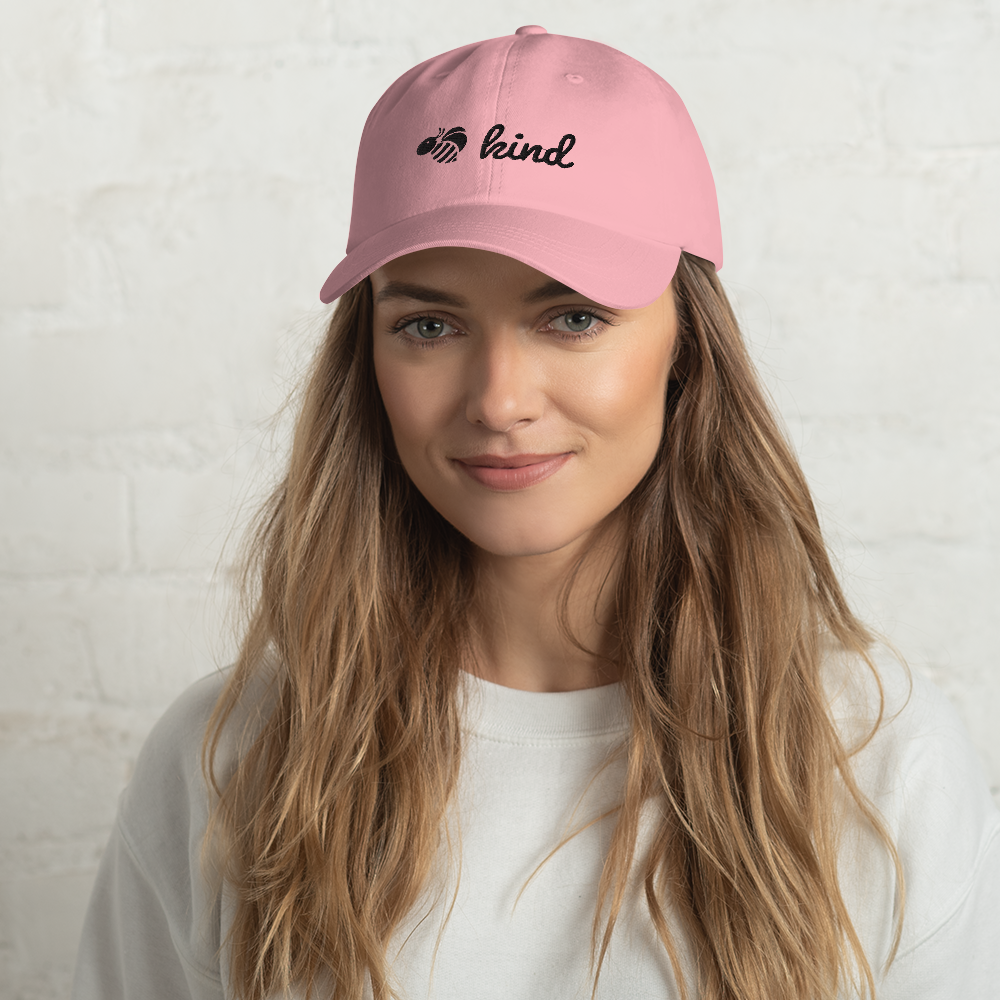 Woman wearing pink Bee Kind Novelty Hat front