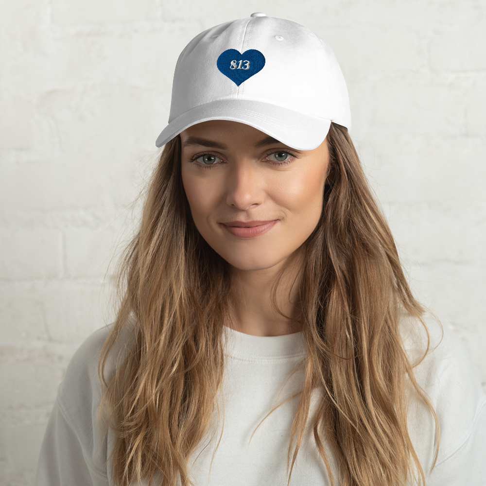 Woman wearing white Tampa Bay Area Code Hat.