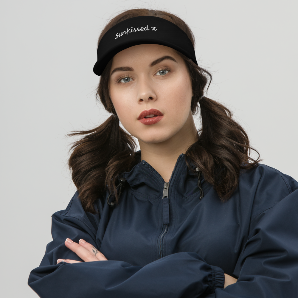 Brown haired woman wearing sun kissed dryfit visor. 