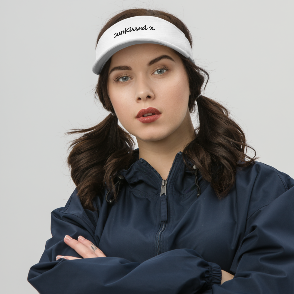 Brown haired woman wearing sun kissed dryfit visor. 