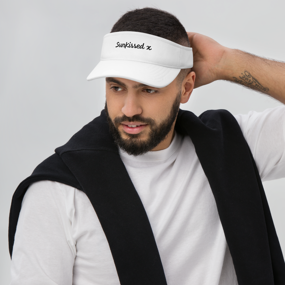 Brown haired woman wearing sun kissed dryfit visor. 